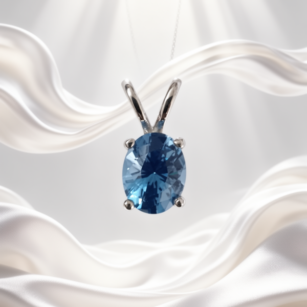 Swiss Blue Topaz Oval Pendant in Rhodium-Plated Sterling Silver