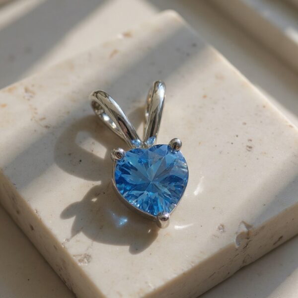 Ocean Heart Swiss Blue Topaz Pendant in Rhodium-Plated Sterling Silver